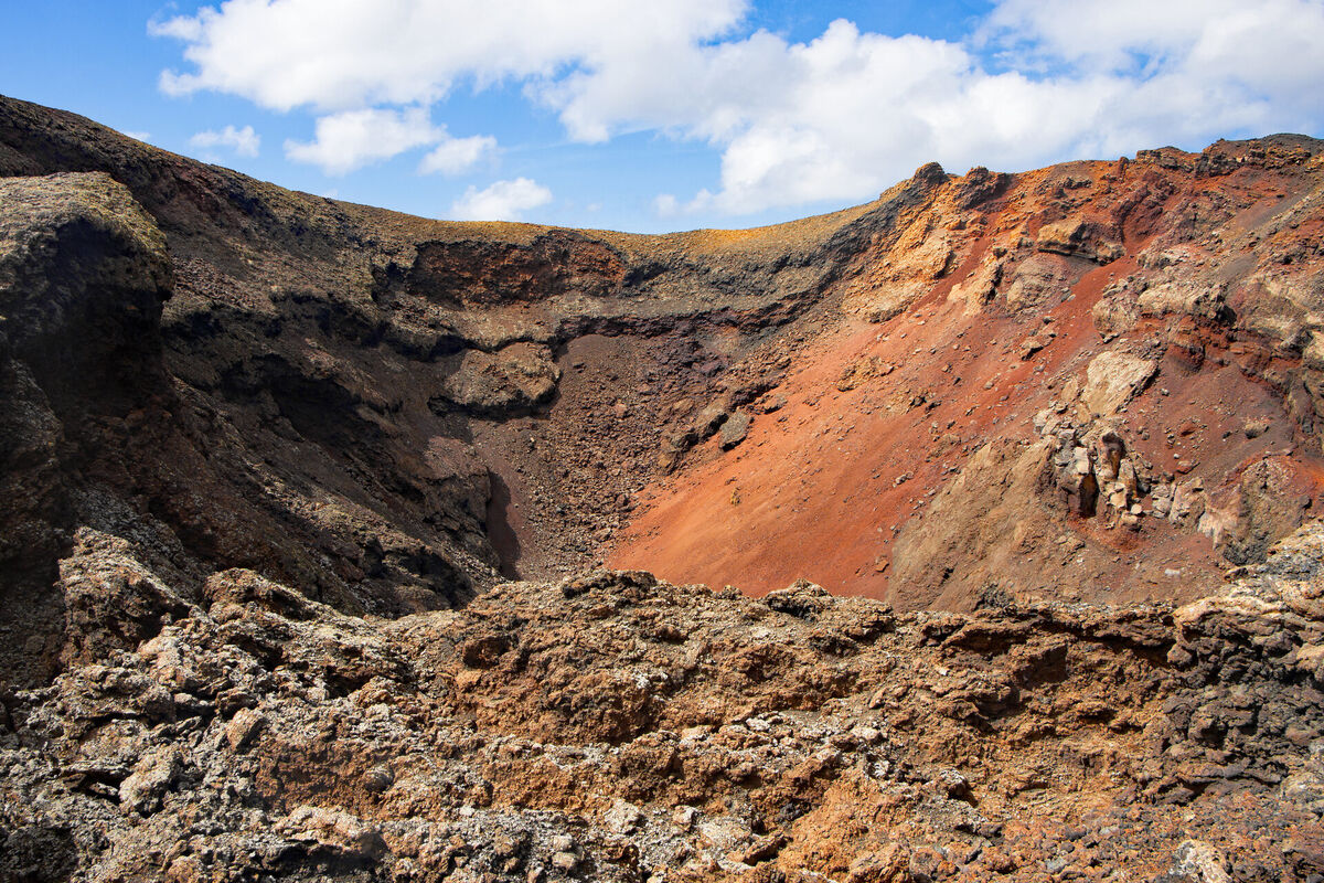 Lanzarote's volcanic interior under a clear afternoon sky, looking north from La Geria towards Famara