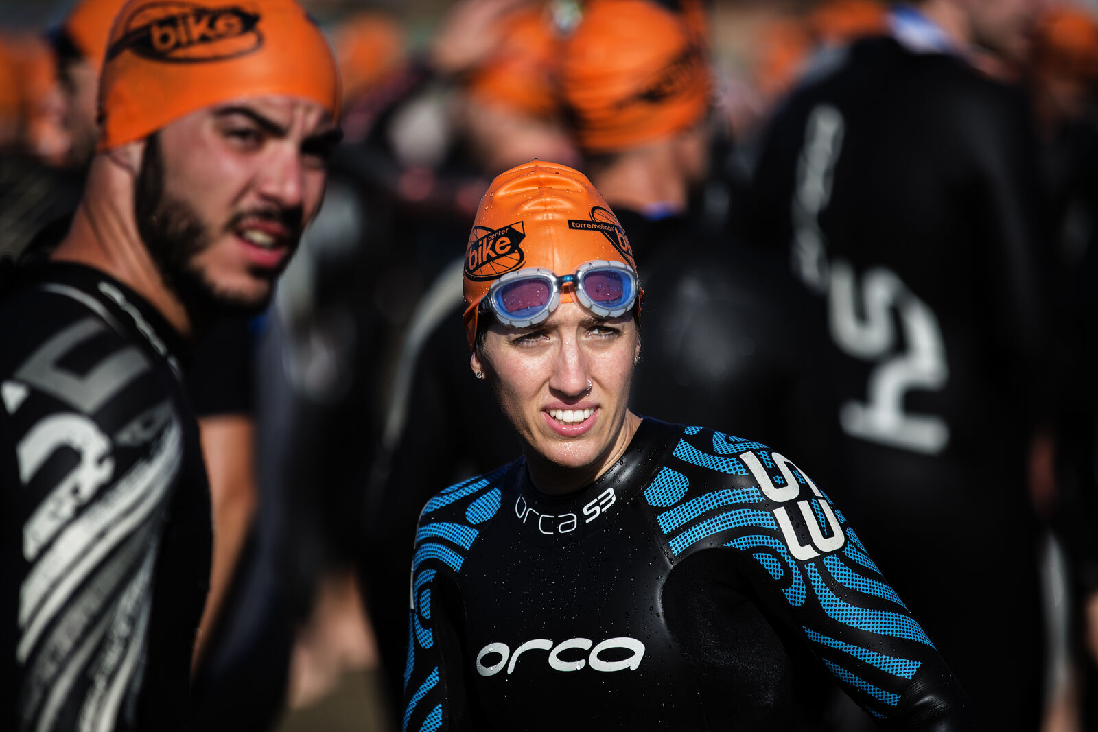 Open-water swimmers at the start of a triathlon swim leg, Ocean Lava Lanzarote takes place 24 October 2026 at Playa Grande, Puerto del Carmen