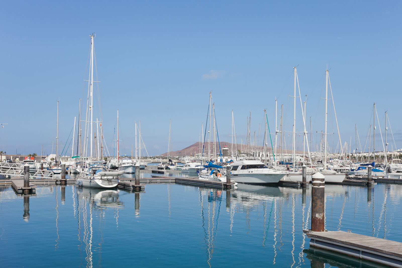Marina Rubicón in Playa Blanca, Lanzarote, with moored sailboats and waterfront restaurants