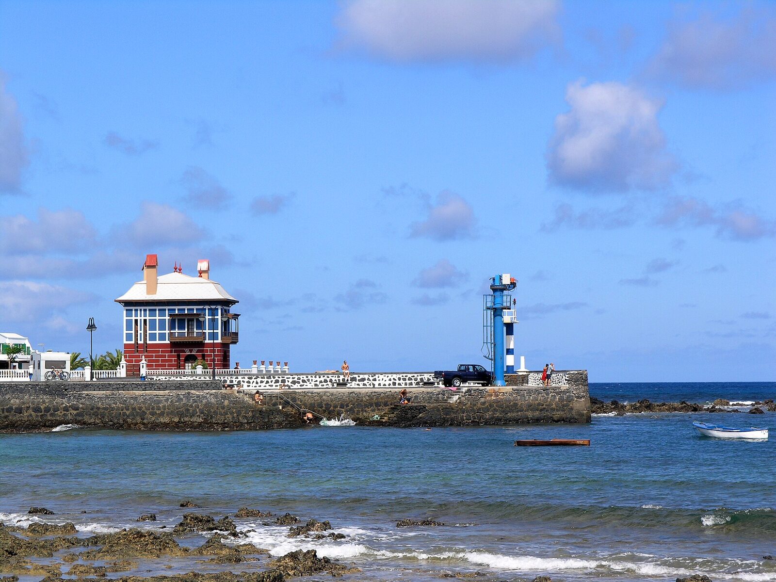 The blue and red house and jetty at the harbour in Arrieta, Lanzarote