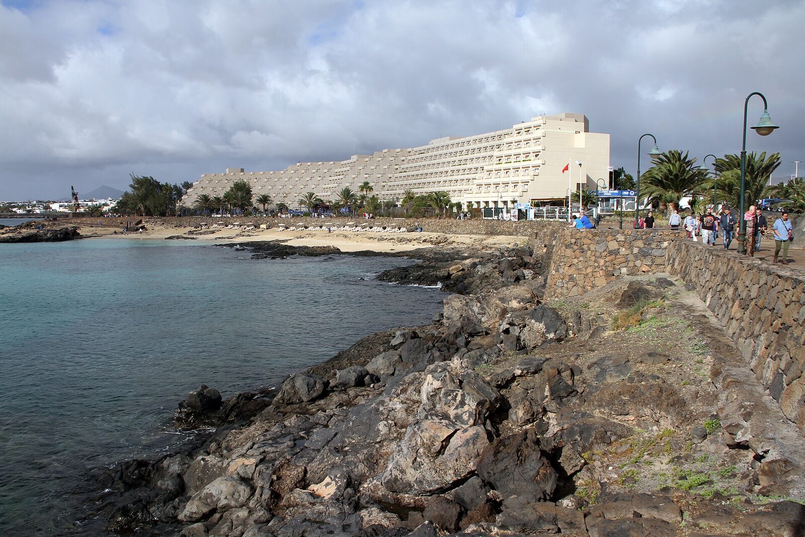 The rocky volcanic shore and cove by the hotel at Playa El Ancla, Costa Teguise