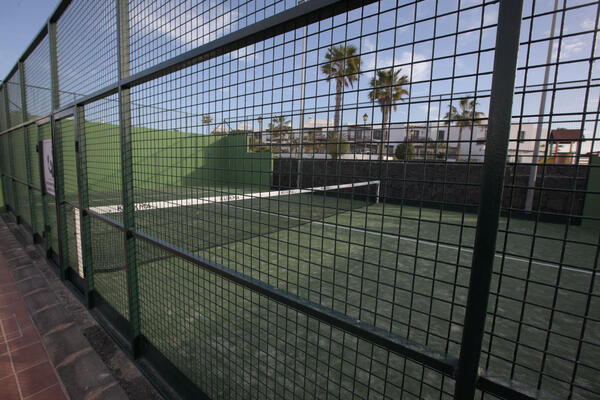 On-site padel and tennis courts seen from the rooftop