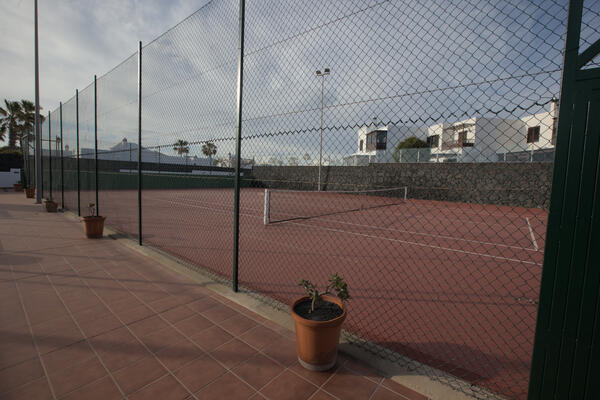 Tennis court facility with ocean views
